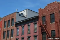 Divisive Statue’s Green-Wood Move Sparks Outcry