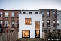 South Slope Townhouse Transformed: Rear Addition Brings Light, Space, and Modern Utility