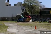 Quirky Dumpster Structure Emerges on Domino Lot