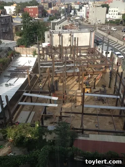 Pre-development image showing former foundation and empty lot at 44 Maspeth