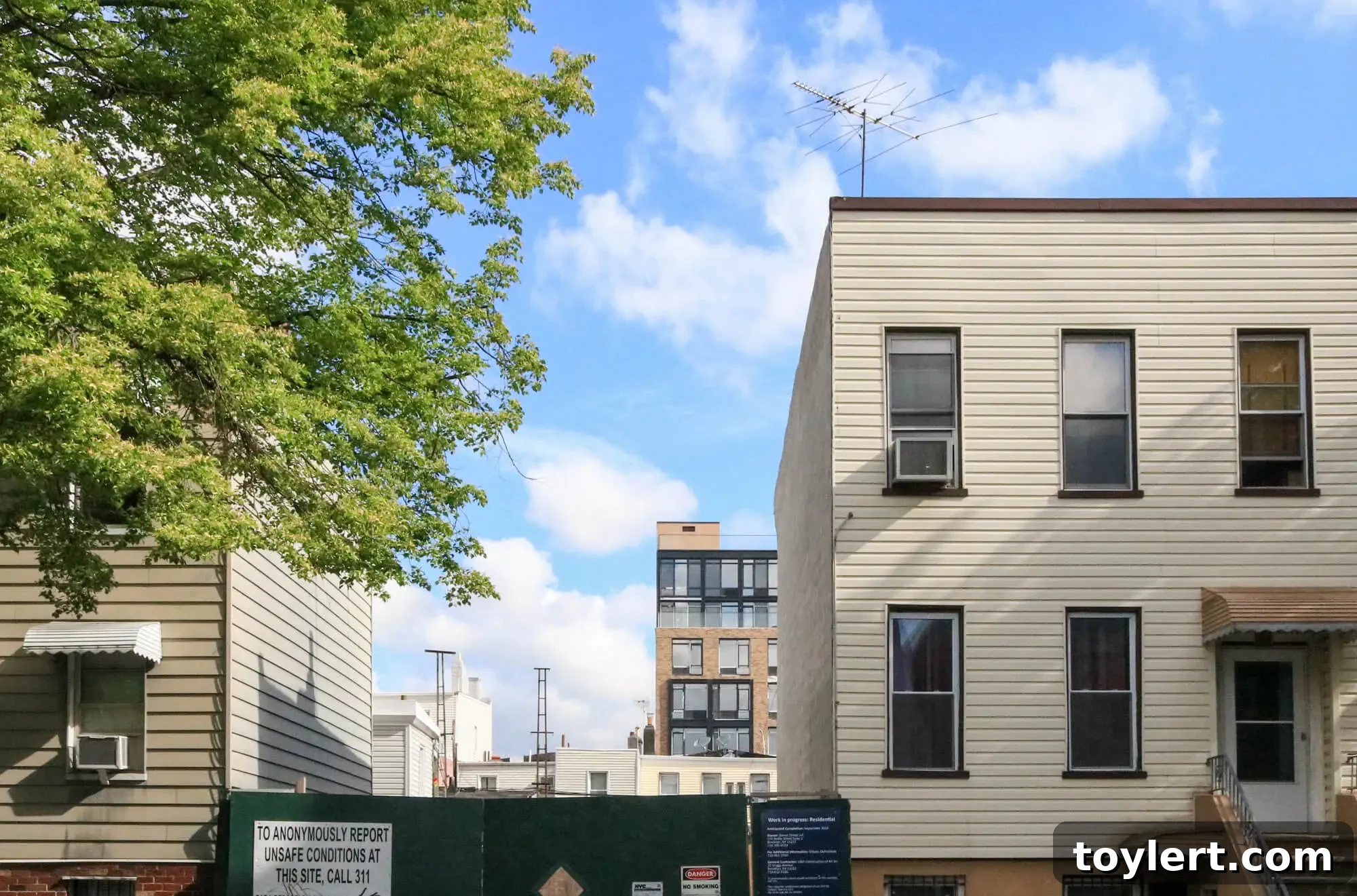 Brooklyn's housing landscape featuring historic row houses alongside modern new construction projects in Williamsburg, symbolizing the blend of old and new in the city's urban development amid its housing crisis.