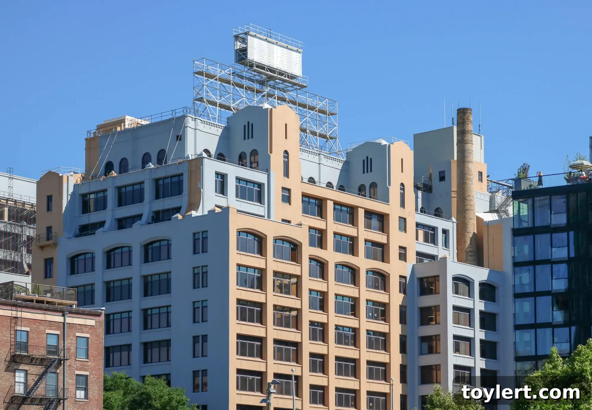 The Yellow Watchtower: A Vanished Icon from Brooklyn's Waterfront 2 The former Jehovah's Witnesses Watchtower complex in Brooklyn Heights undergoing repainting from yellow to gray