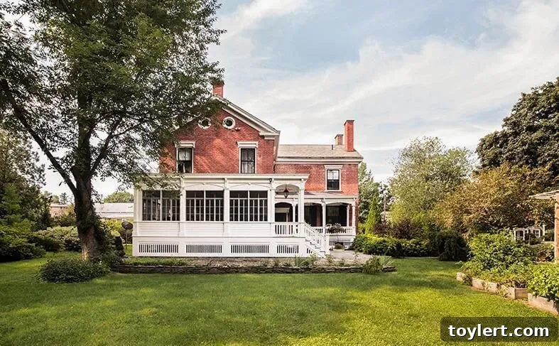 Historic home at 4 Albany Avenue, Kinderhook, NY, showcasing architectural charm and an expansive acre of land in a walkable downtown setting.