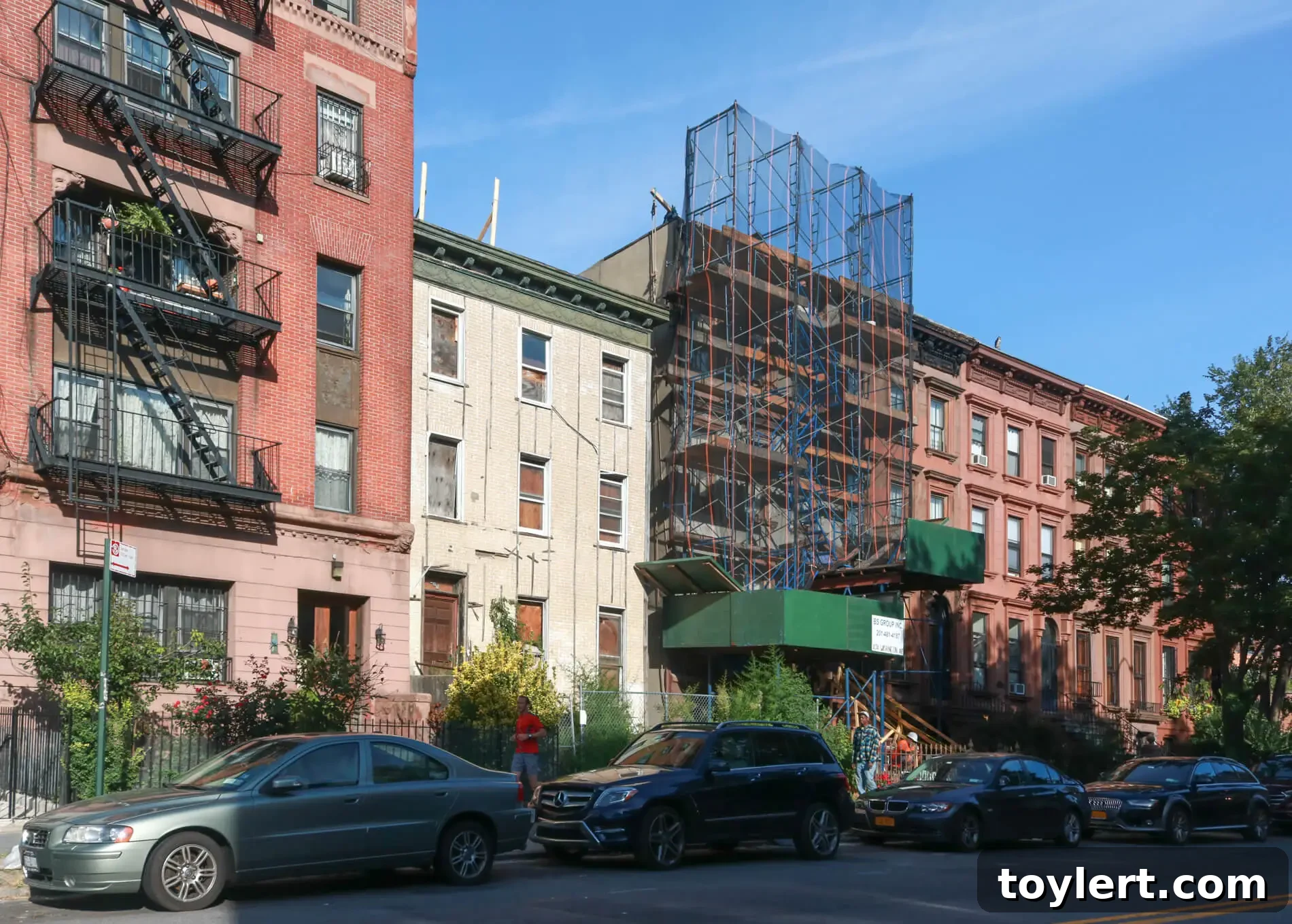 A striking modern row house at 476 Washington Avenue in Clinton Hill, featuring stylized board-and-batten siding and contemporary design by NV.Design.Architecture, blending seamlessly into the historic streetscape.