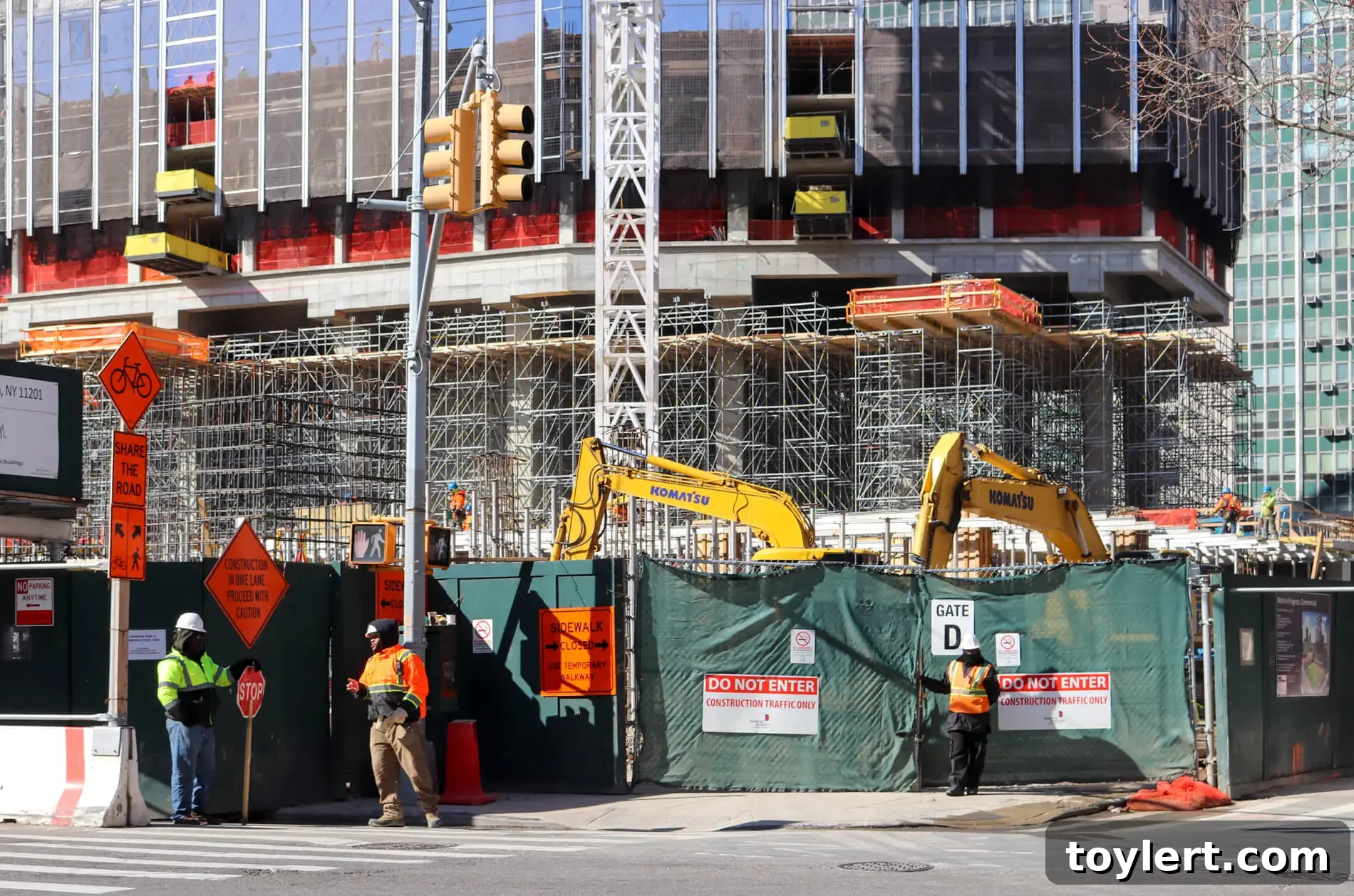 Downtown Brooklyn Construction: Workers on a high-rise building at 9 Dekalb Avenue, showcasing ongoing urban development.