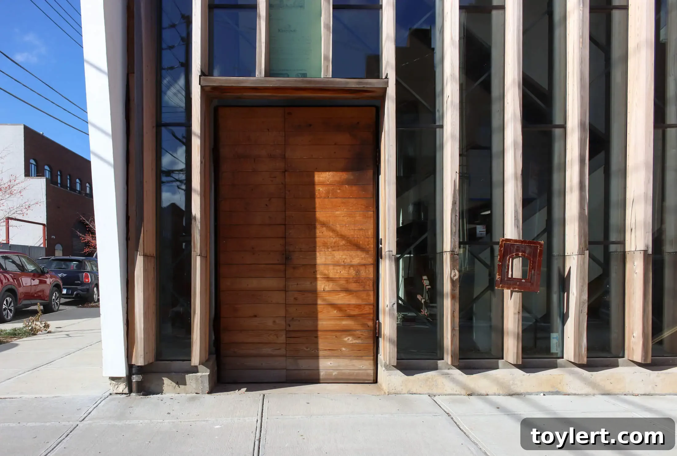 Detail of the main entrance to Project Genesis, highlighting modern design elements and inviting entry into the new Red Hook venue.