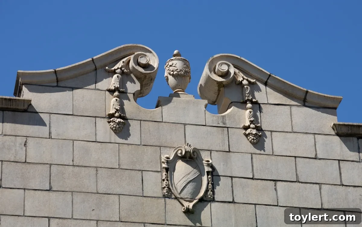 Close-up detail of an ornate pediment on a taxpayer building, featuring a decorative urn and a shield, highlighting the unexpected architectural embellishments.