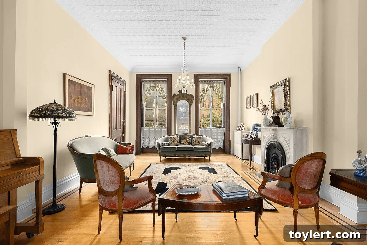 Elegant parlor in a Brooklyn brownstone featuring a classic marble mantelpiece, ornate fireplace, and sophisticated decor, typical of luxury homes in Cobble Hill or Park Slope.