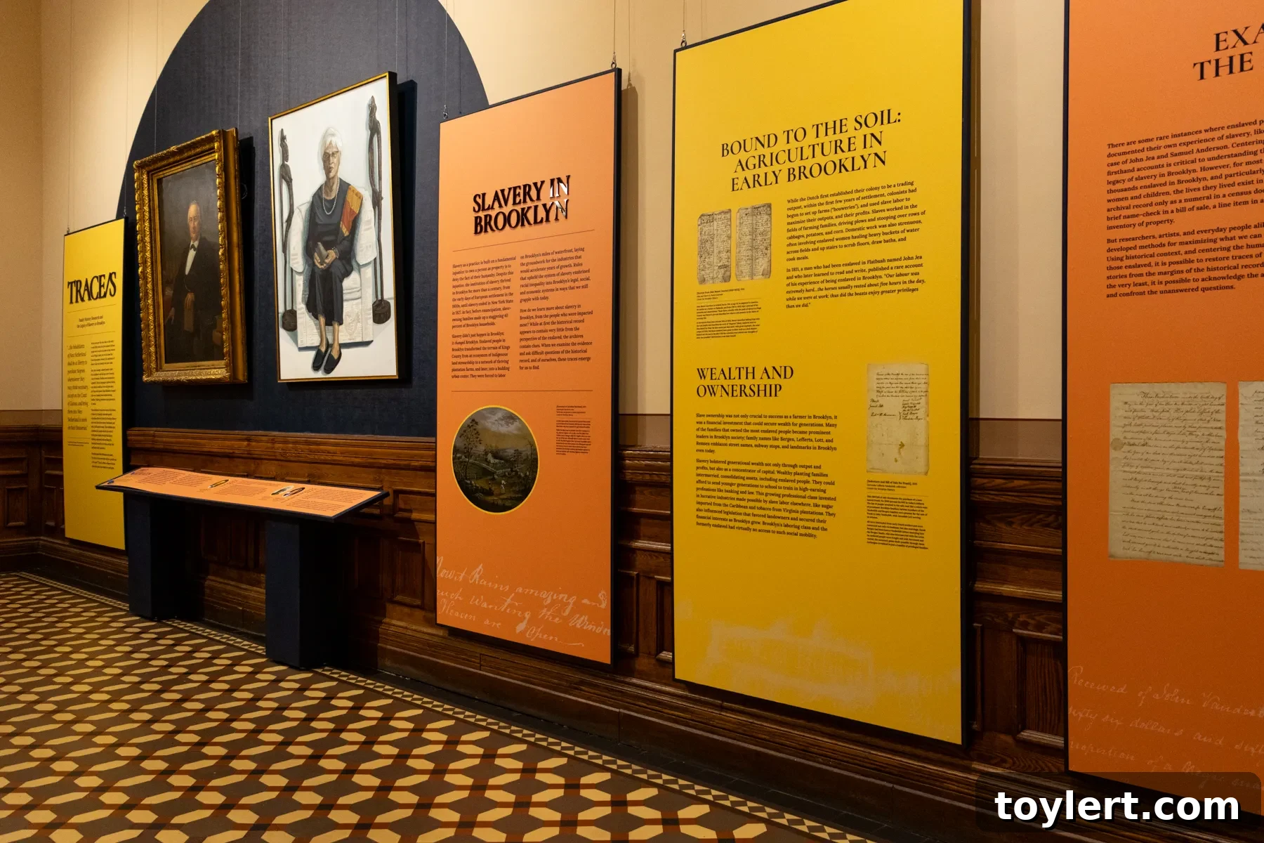 Exhibition panels detailing the history of slavery in Brooklyn, featuring historical documents and personal stories.