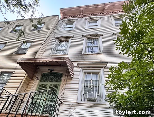 Charming wooden frame house with classic architectural details in Bushwick, Brooklyn