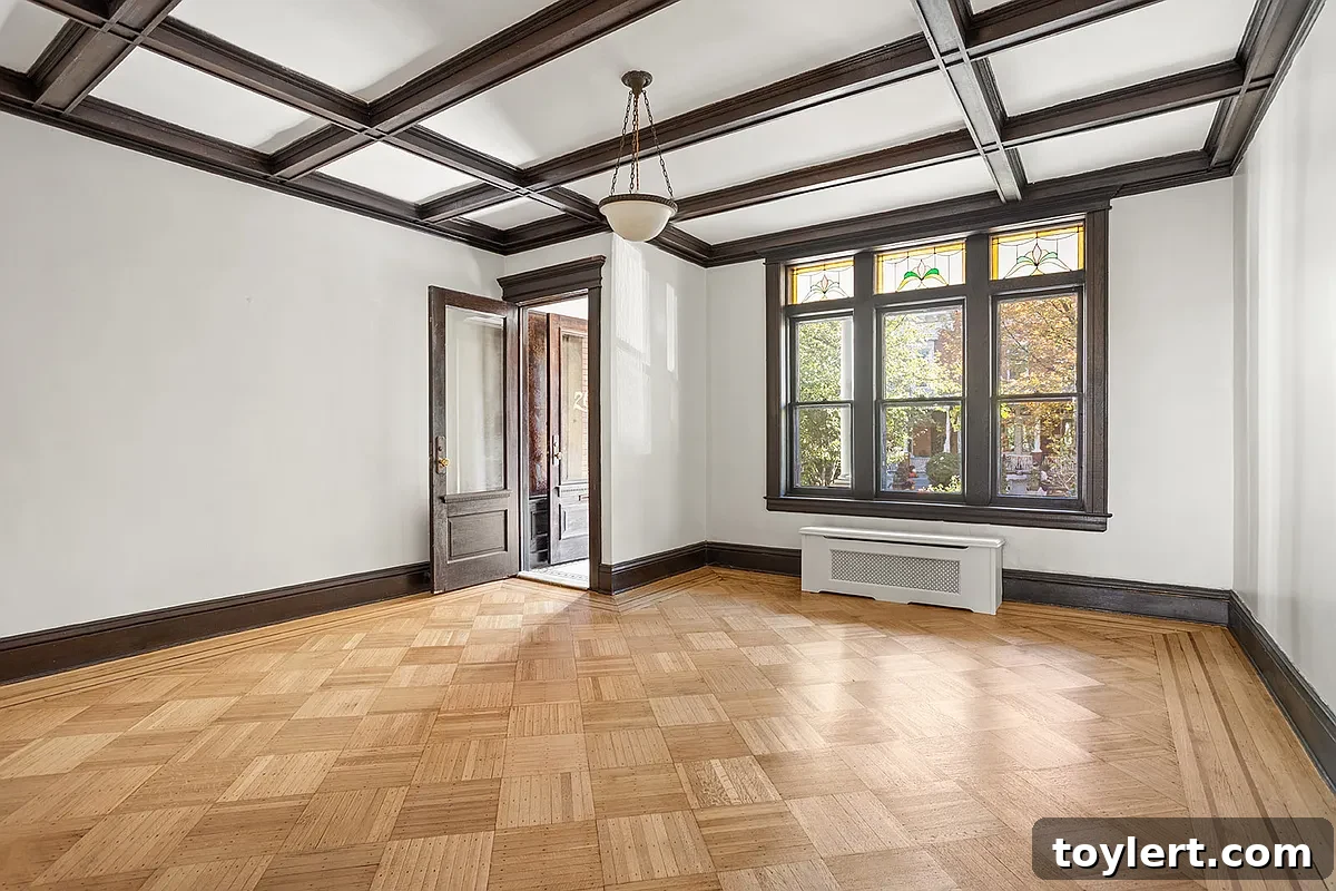 Sunset Park Brownstone: Discover Value From $1.389 Million 2 Elegant living room with a striking beamed ceiling and abundant natural light.