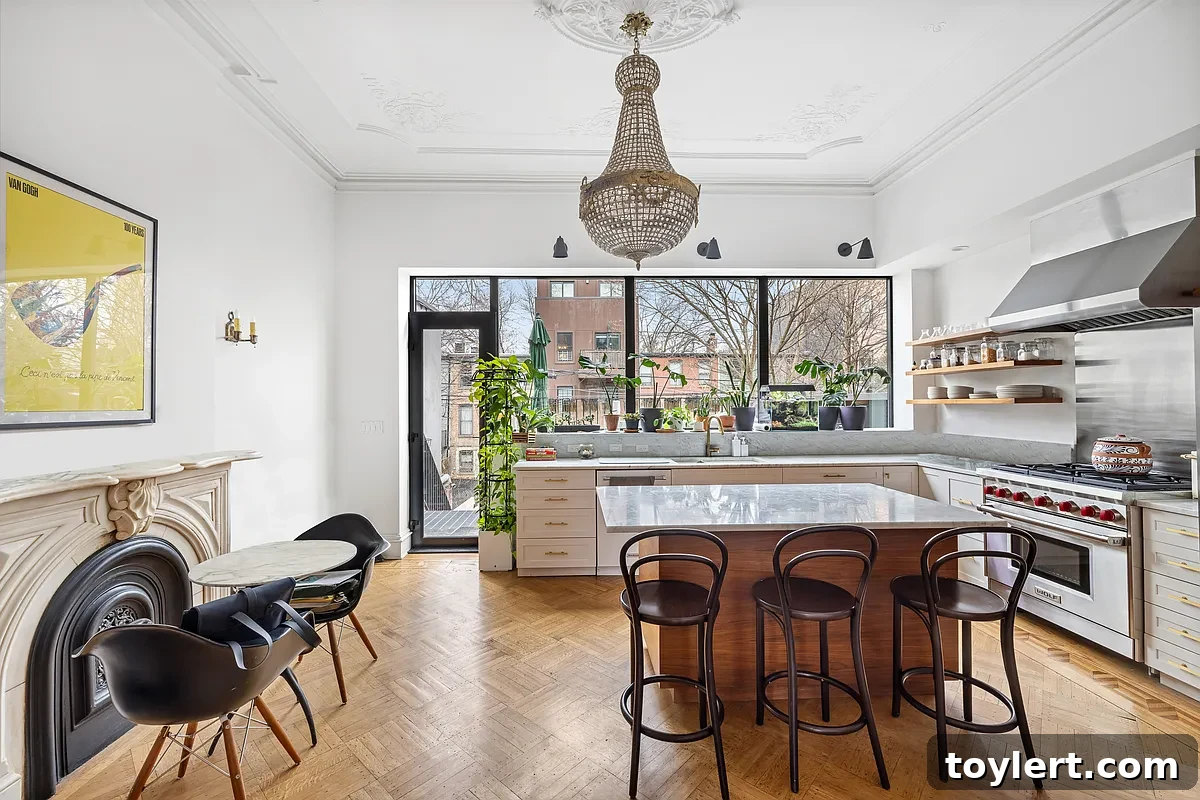 Elegant kitchen with marble mantel, modern stainless steel appliances, and a classic design that perfectly blends historic charm with contemporary luxury in a Brooklyn brownstone.